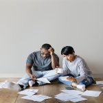 stressed couple figuring out their finances