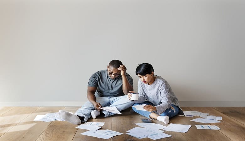 stressed couple figuring out their finances