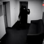 two dangerous masked men disarming burglar alarm system, braking into bank vault